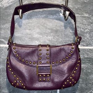 Leather shoulder bag with metal studs